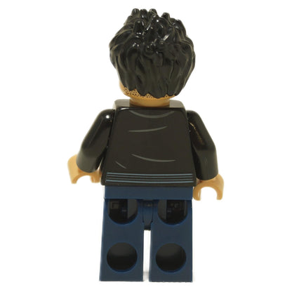 Back view of LEGO® Xavier Dobbs minifigure (jw133) showing printed jacket details and dark blue legs from Jurassic World: Chaos Theory.
