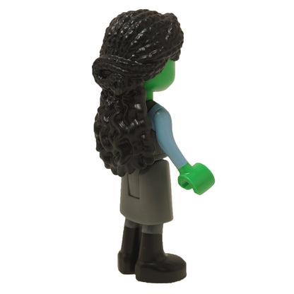 Side view of Elphaba minifigure showing textured black hair, green skin, dark bluish gray skirt and black boots
``
