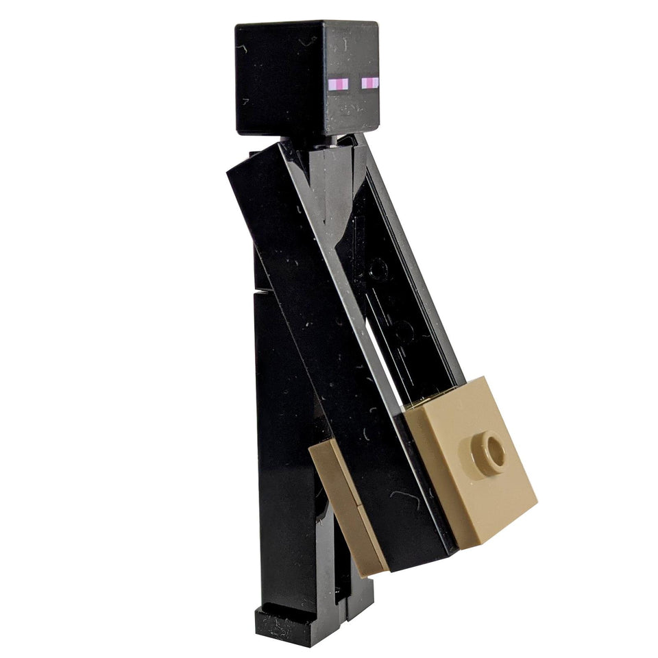 A LEGO minifigure of an Enderman from the Minecraft game, featuring a tan block with dark tan top and bottom.