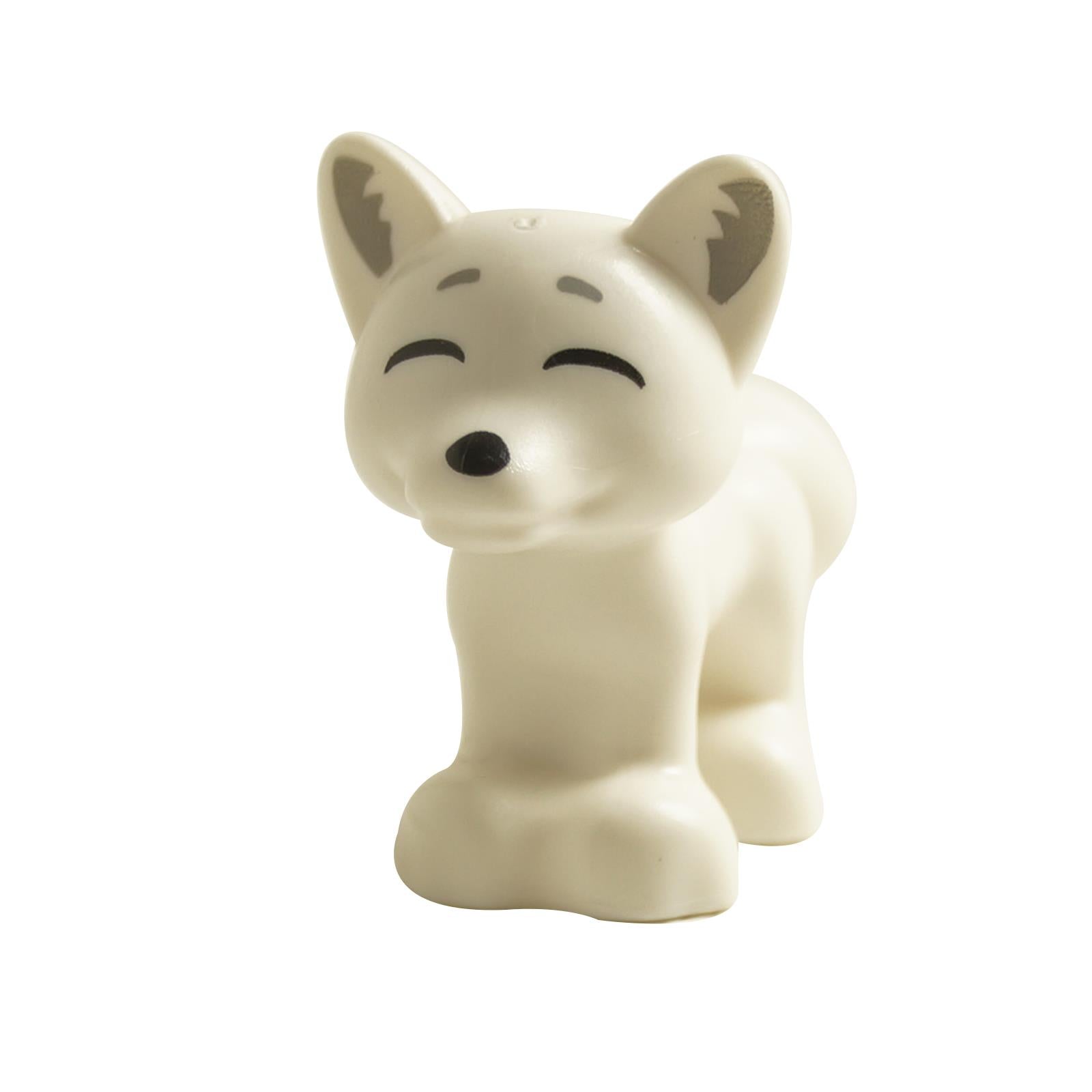 Front view of white fox figure with closed smiling eyes, upright ears and black nose