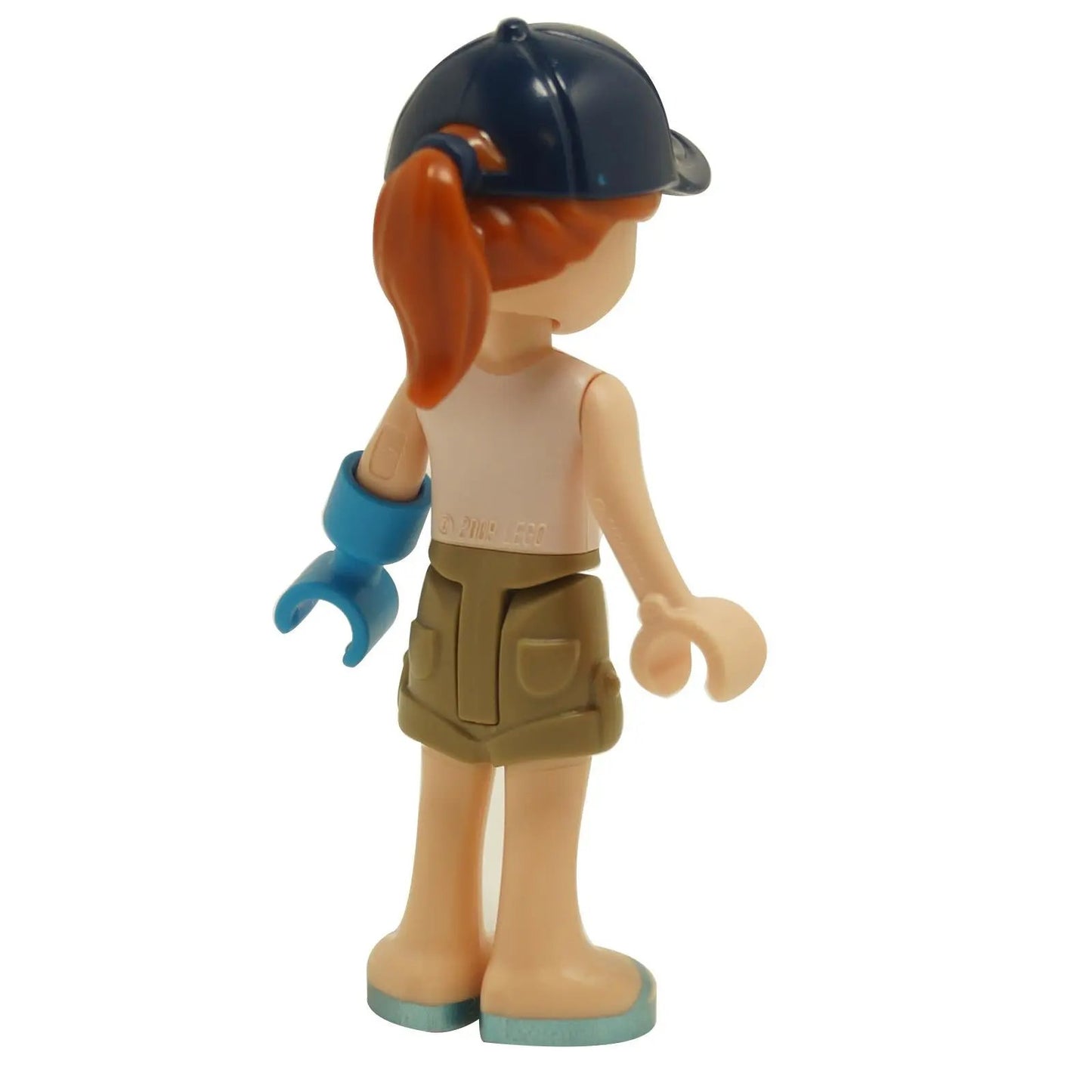 LEGO Friends Autumn mini doll back view wearing camping outfit with dark blue cap, tan shorts and blue prosthetic arm