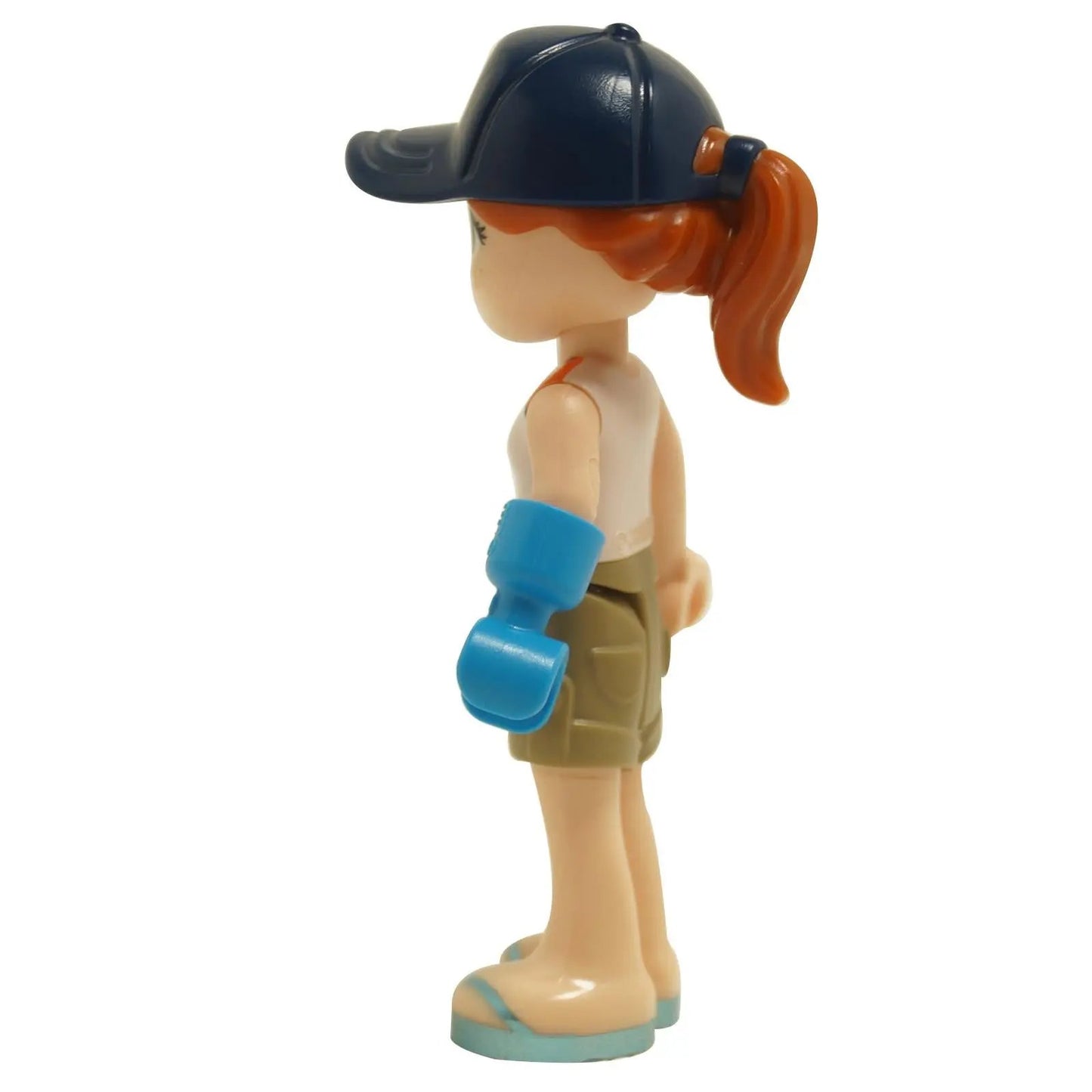 LEGO Friends Autumn mini doll side view wearing camping outfit with dark blue cap, raccoon logo shirt, tan shorts and blue prosthetic arm