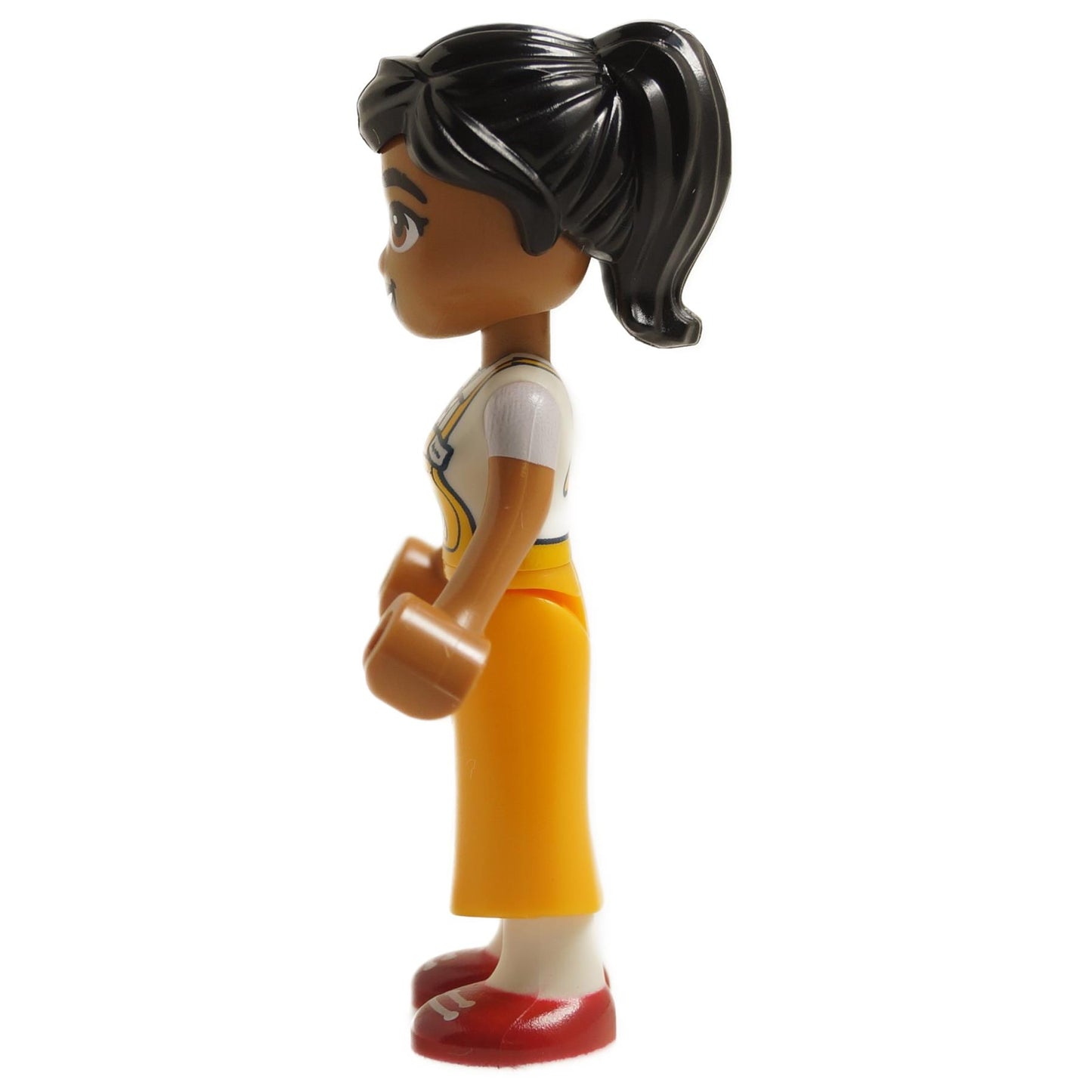 Side view of LEGO Friends Beatriz mini-doll frnd0747 with dark hair, yellow apron skirt and red shoes