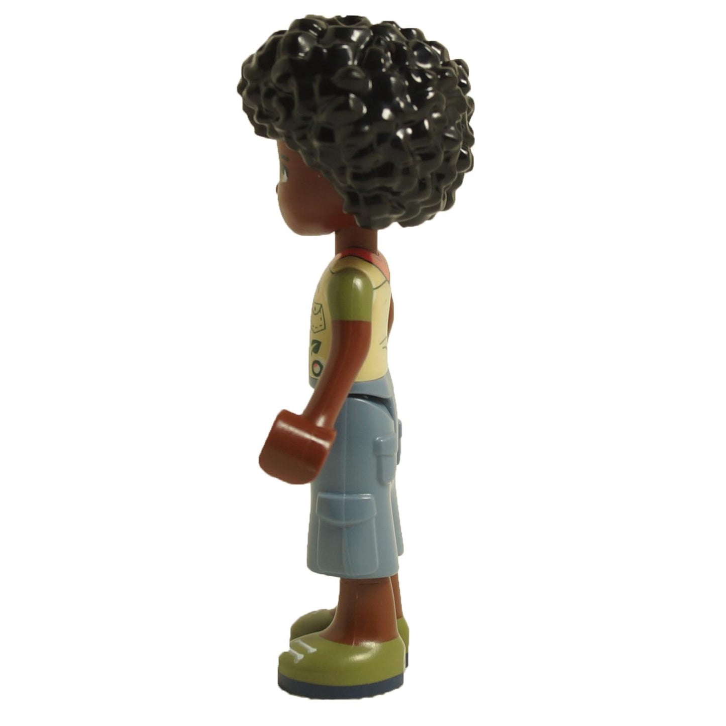 Side view of LEGO® Friends Joaquim mini-doll frnd526 wearing scout vest with badges, blue shorts and curly hair