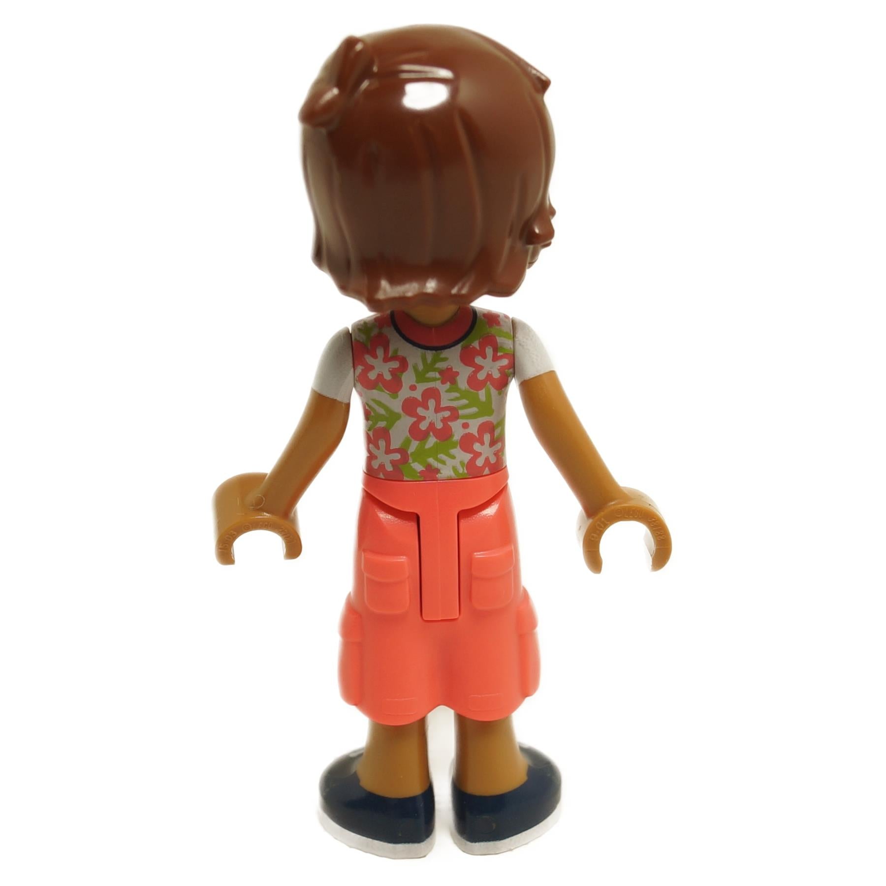 Back view of LEGO® Friends Leo mini-doll frnd712 with white shirt printed with coral flowers and coral cropped trousers with large pockets