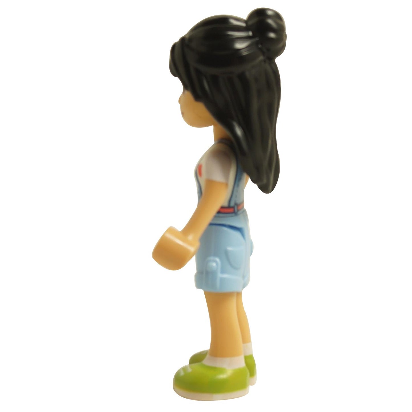 Side view of LEGO® Friends Liann mini-doll wearing bright light blue overalls and long hair