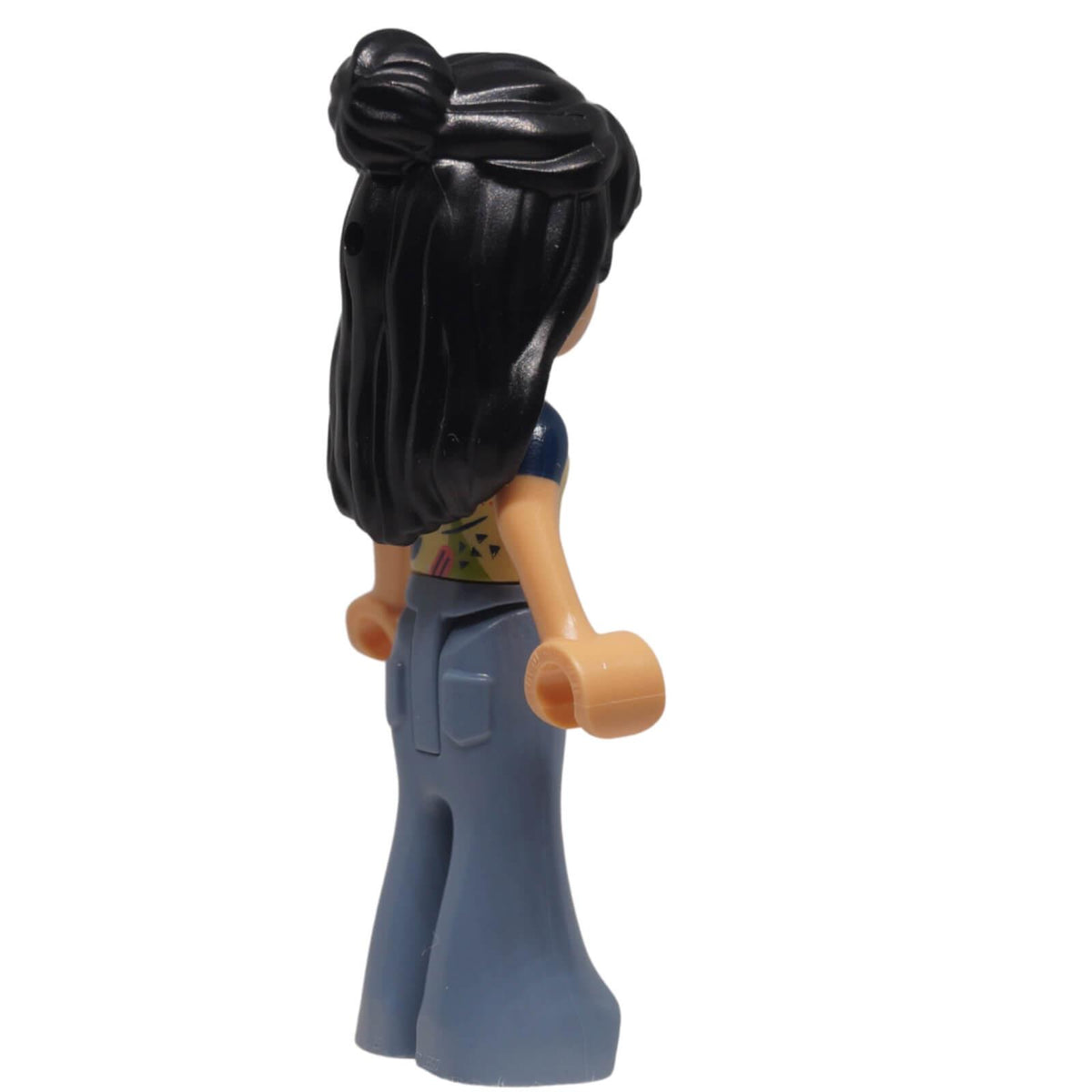 LEGO® Friends Liann mini-doll frnd0751 right side view showing raised hair bun, long hair and moulded trouser pockets