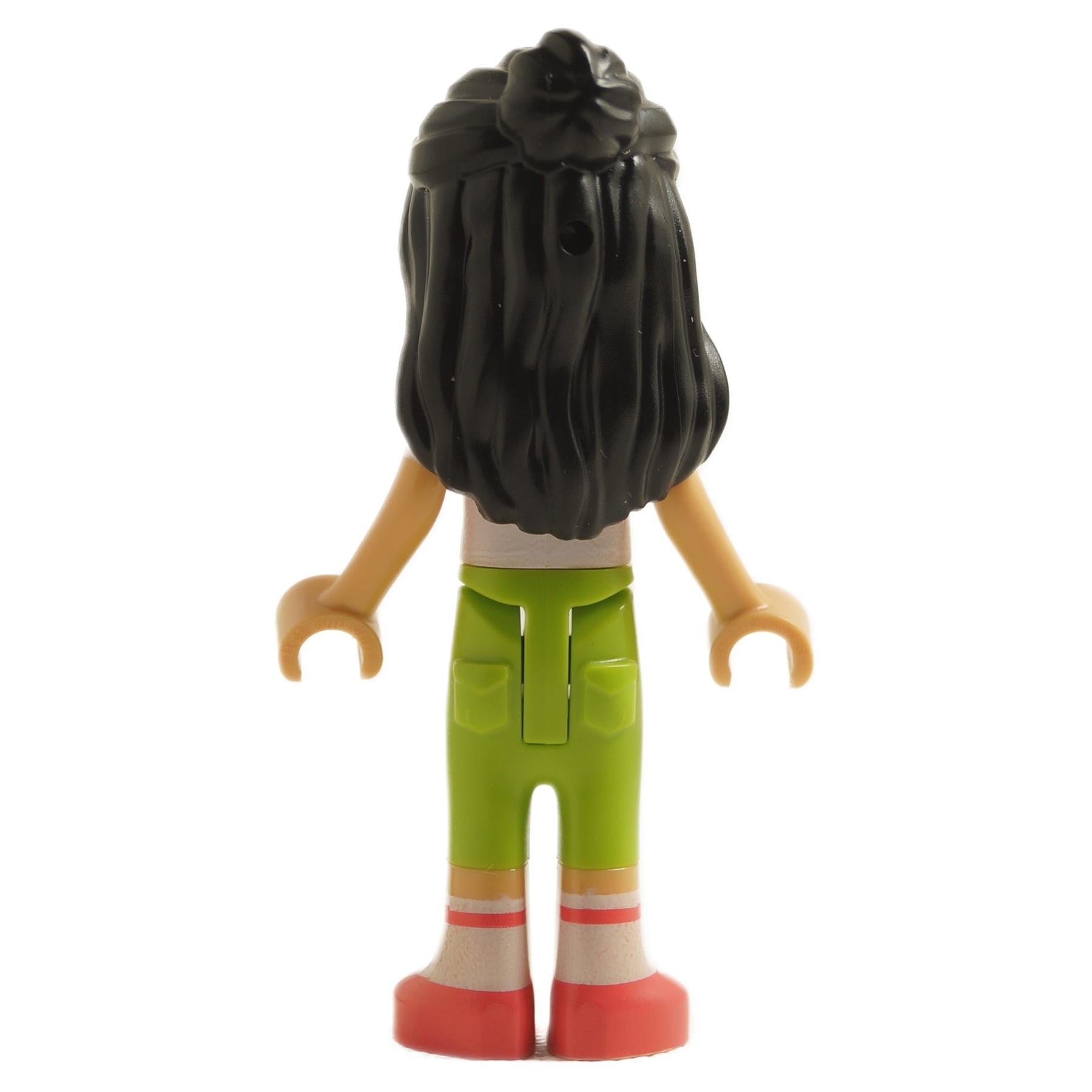 back view of LEGO Friends Liann mini doll with long black hair wearing white knotted t-shirt green trousers white socks and red shoes
