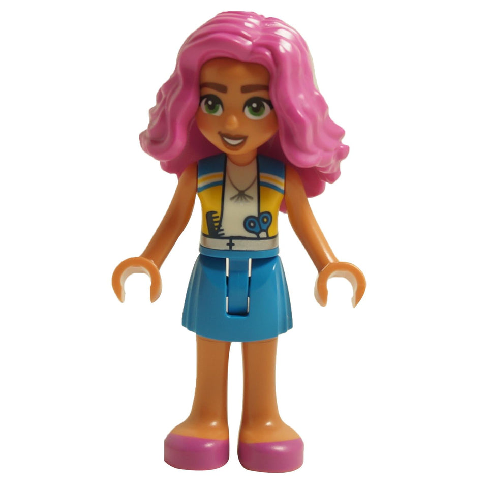 LEGO Friends mini-doll with vibrant pink hair, wearing a yellow and blue vest over a printed shirt, blue skirt, and pink shoes.