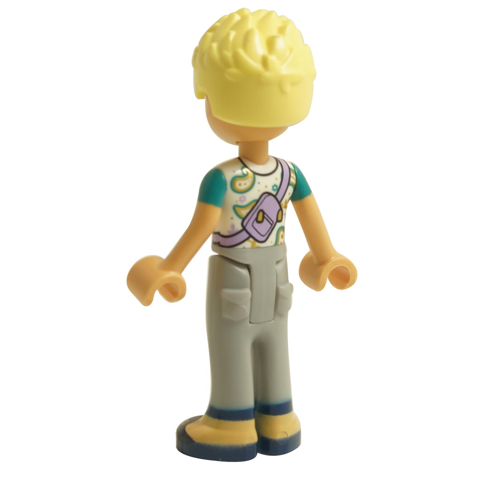 Back view of LEGO® Friends Olly mini-doll frnd588 wearing white paisley shirt and blue shorts