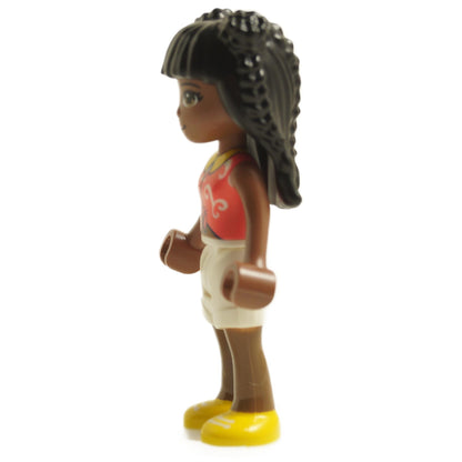 Side view of LEGO® Friends Priyanka mini-doll wearing a coral knotted blouse with white swirl pattern, white shorts, and yellow shoes
