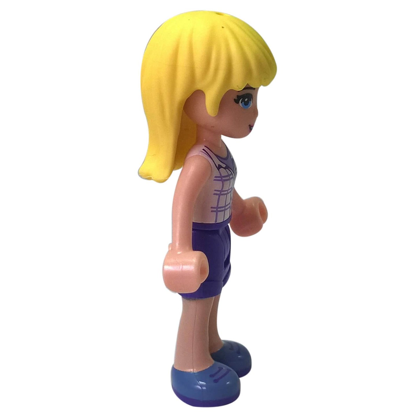 side view of LEGO Friends Stephanie mini doll with blonde hair wearing white plaid shirt dark purple shorts and blue shoes
