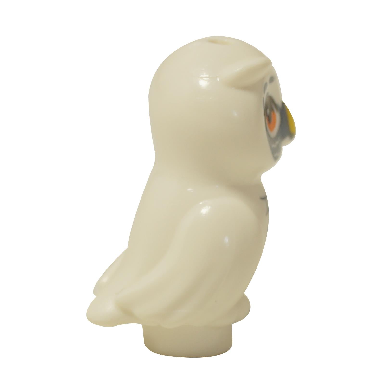 LEGO Friends white owl figure (21333pb06) shown in profile with orange eyes and a yellow beak.