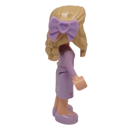 Glinda Mini-Puppe, lavendelfarbenes Kleid, Rückansicht, langes blondes Haar, lila Schleife
