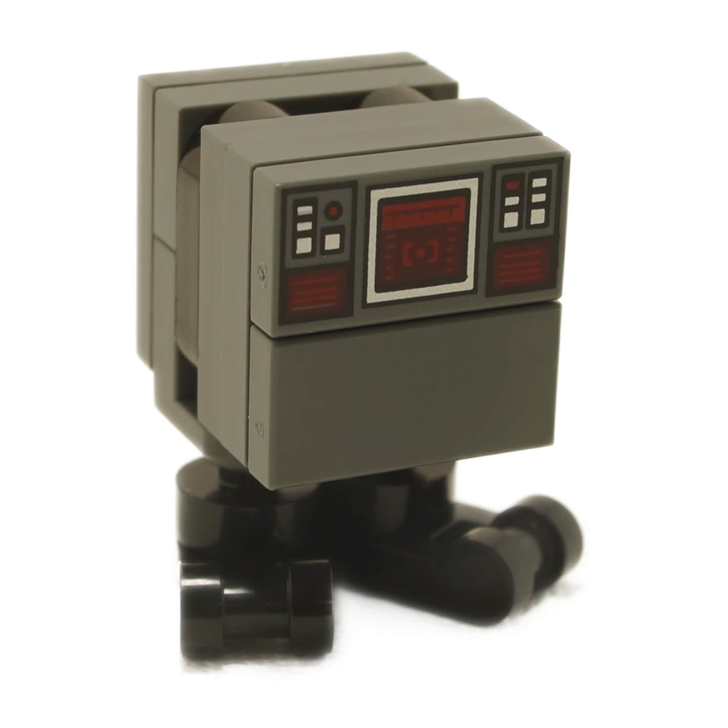 Front angled view of Gonk Droid minifigure sw1314 with dark gray rectangular body, printed red control panel, and short black mechanical legs