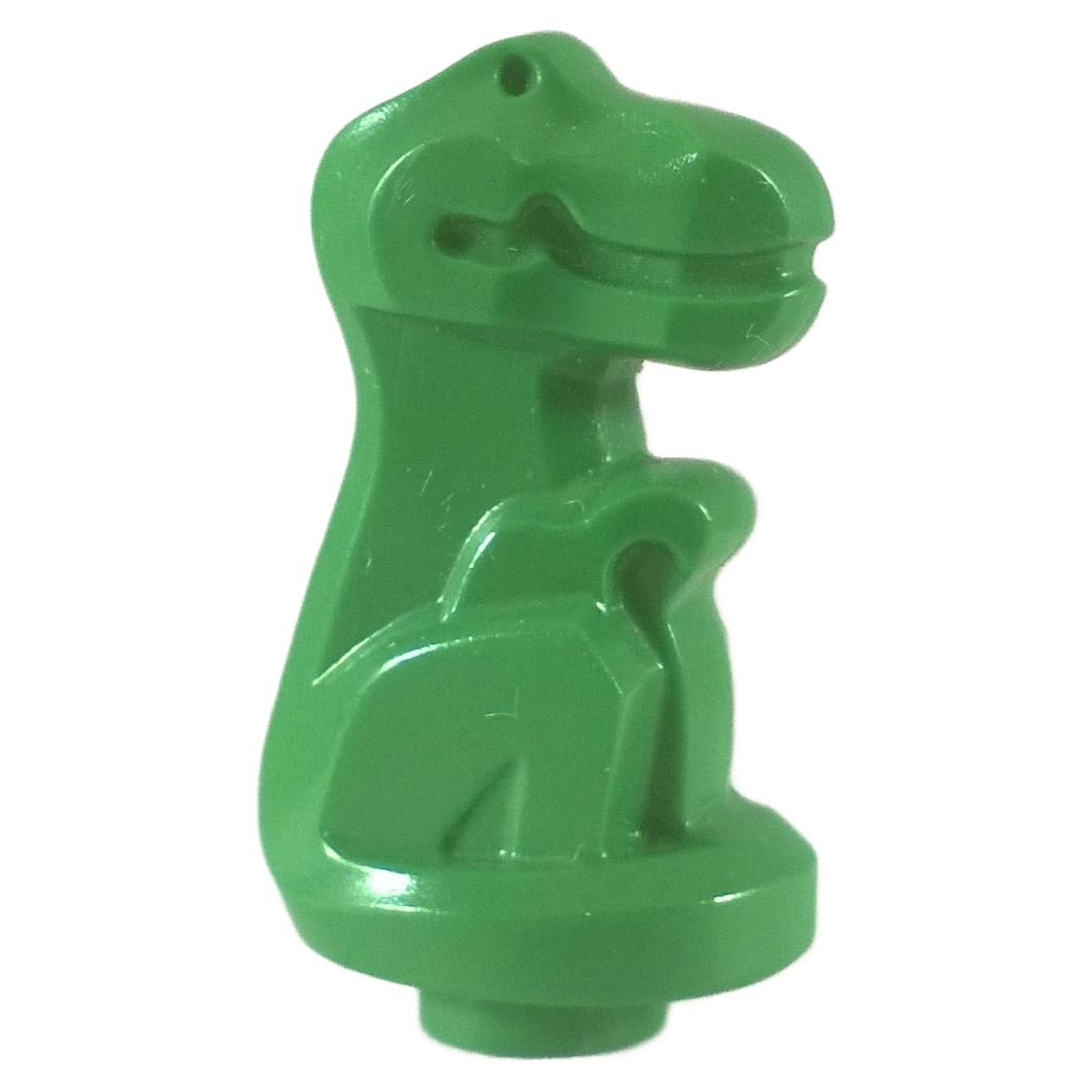 Green dinosaur baby figure in sitting position.
