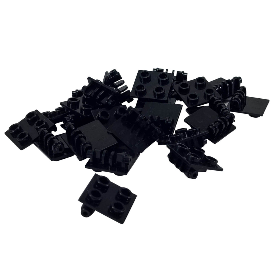 Black hinge brick 2x2 with thin top plate, jointed building element used for folding sections and angled connections
