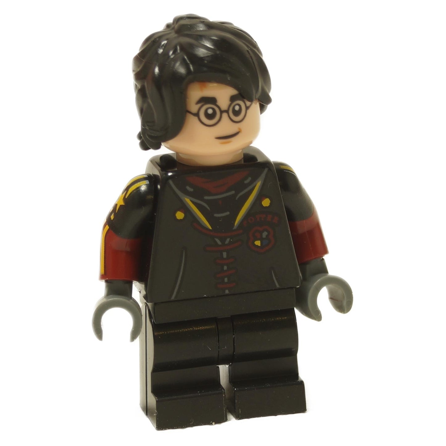 Harry Potter minifigure in black Triwizard Tournament uniform with glasses and messy black hair
