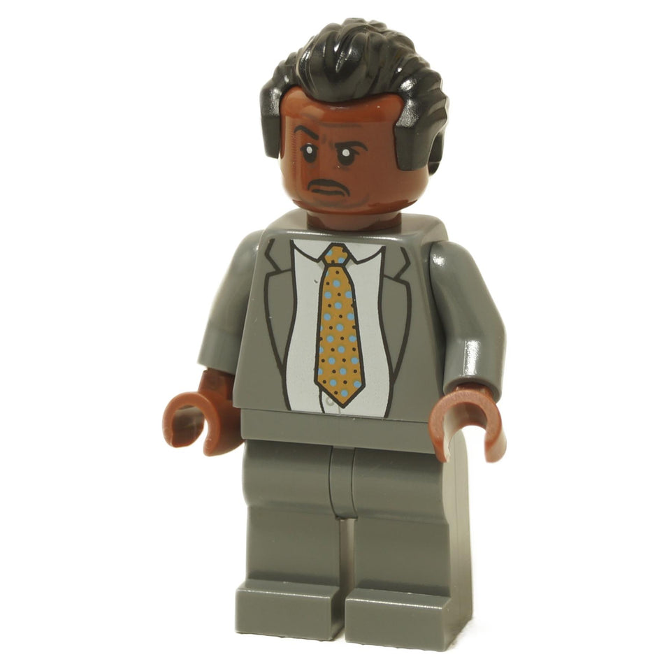 LEGO minifigure of Stanley Hudson from The Office, wearing a grey suit and tie with a polka-dot pattern.