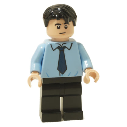 LEGO minifigure of Ryan Howard from The Office, wearing a light blue dress shirt and dark tie, with black pants.
