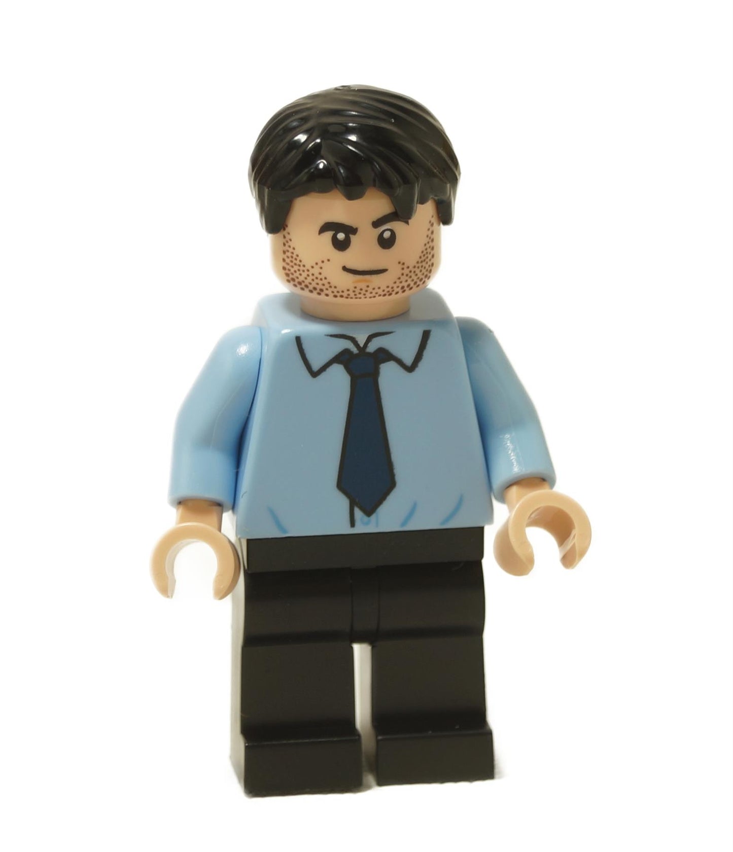 Ryan Howard minifigure with short dark hair, light blue shirt, black tie and slight smirk expression
