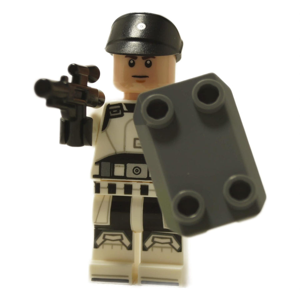 ISB Tactical Agent minifigure holding blaster and rectangular shield, white uniform with black helmet
