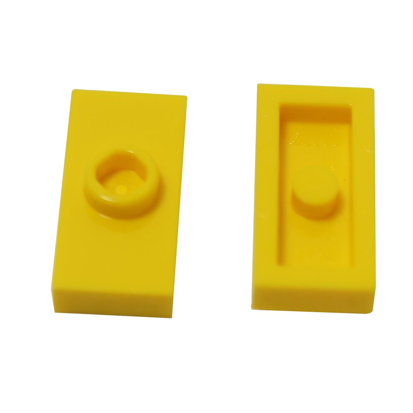 Two yellow LEGO jumper plates with one central stud each, without groove, placed on a white background.