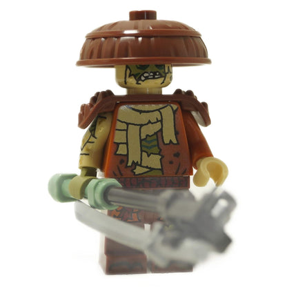 Kur Minifigure Master of Decay holding chain weapon, cracked torso print, brown armor, straw hat
