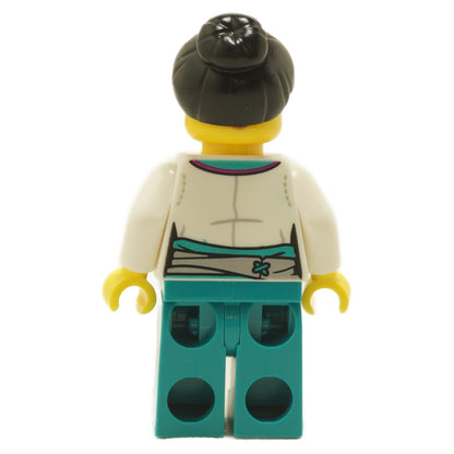 Back view of LEGO® Lee Panda Stall Keeper minifigure mk114 showing white wrap-style torso with teal sash detail and teal legs
