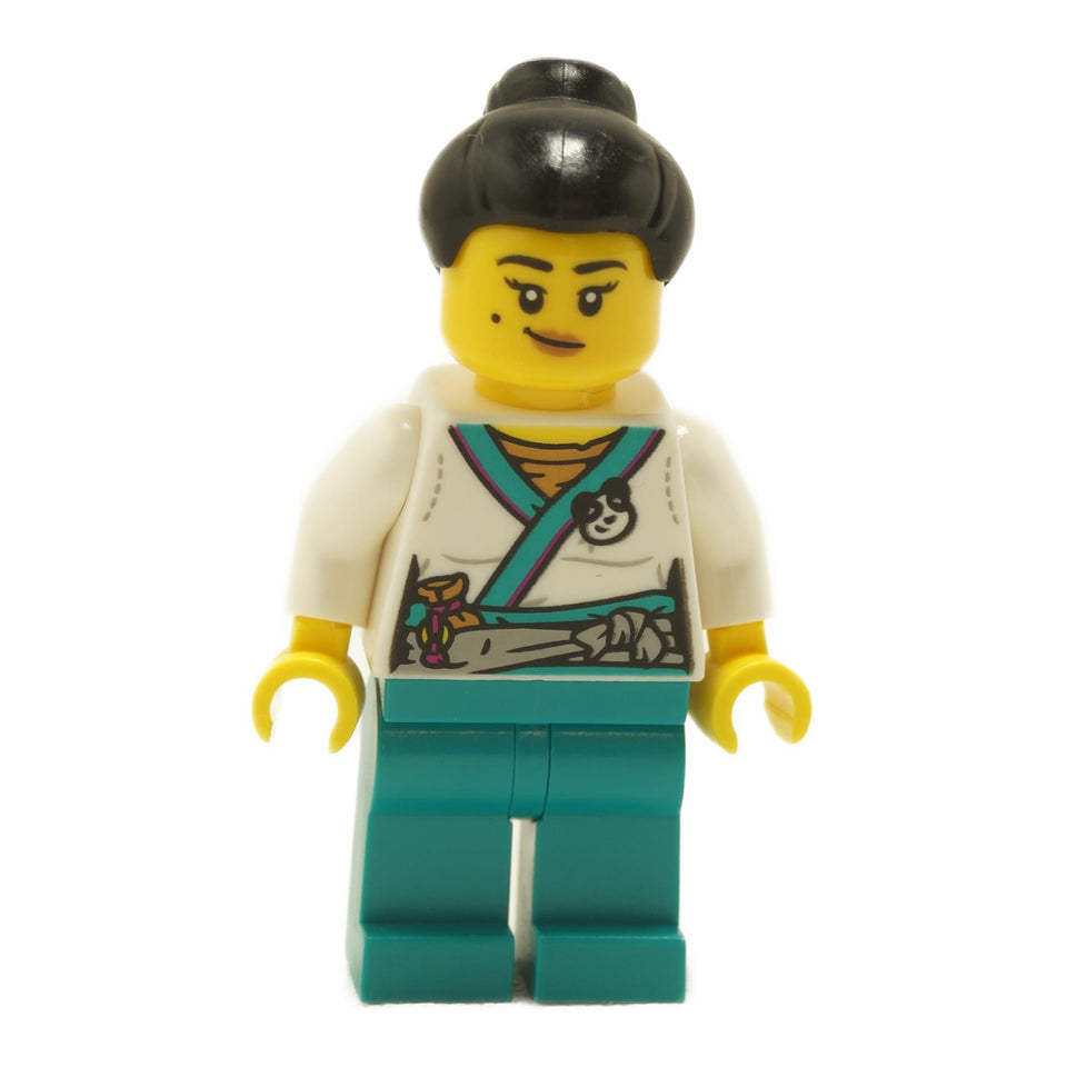 LEGO® Lee minifigure mk114 Panda Stall Keeper wearing white wrap-style top with panda emblem, teal legs, black hair in a bun, and a confident smiling expression
