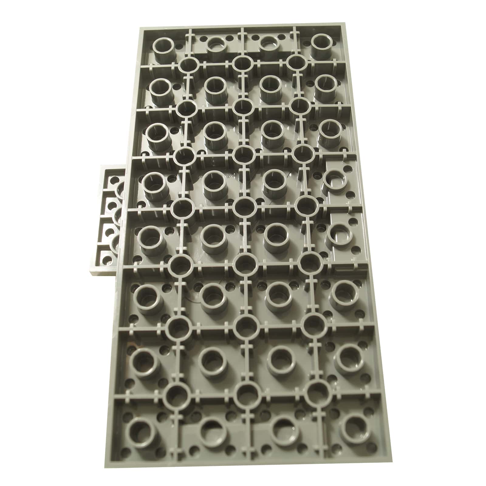Brick Modified 8 x 16 x 2/3 with 1 x 4 Indentations and 1 x 4 Plate in light bluish gray – LEGO® part 18922, large structural panel used for bases and support. Back view.
