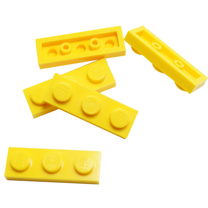 Plate 1 x 3 in yellow– LEGO® part 3623, classic 3-stud plate used for structural support and detailing
