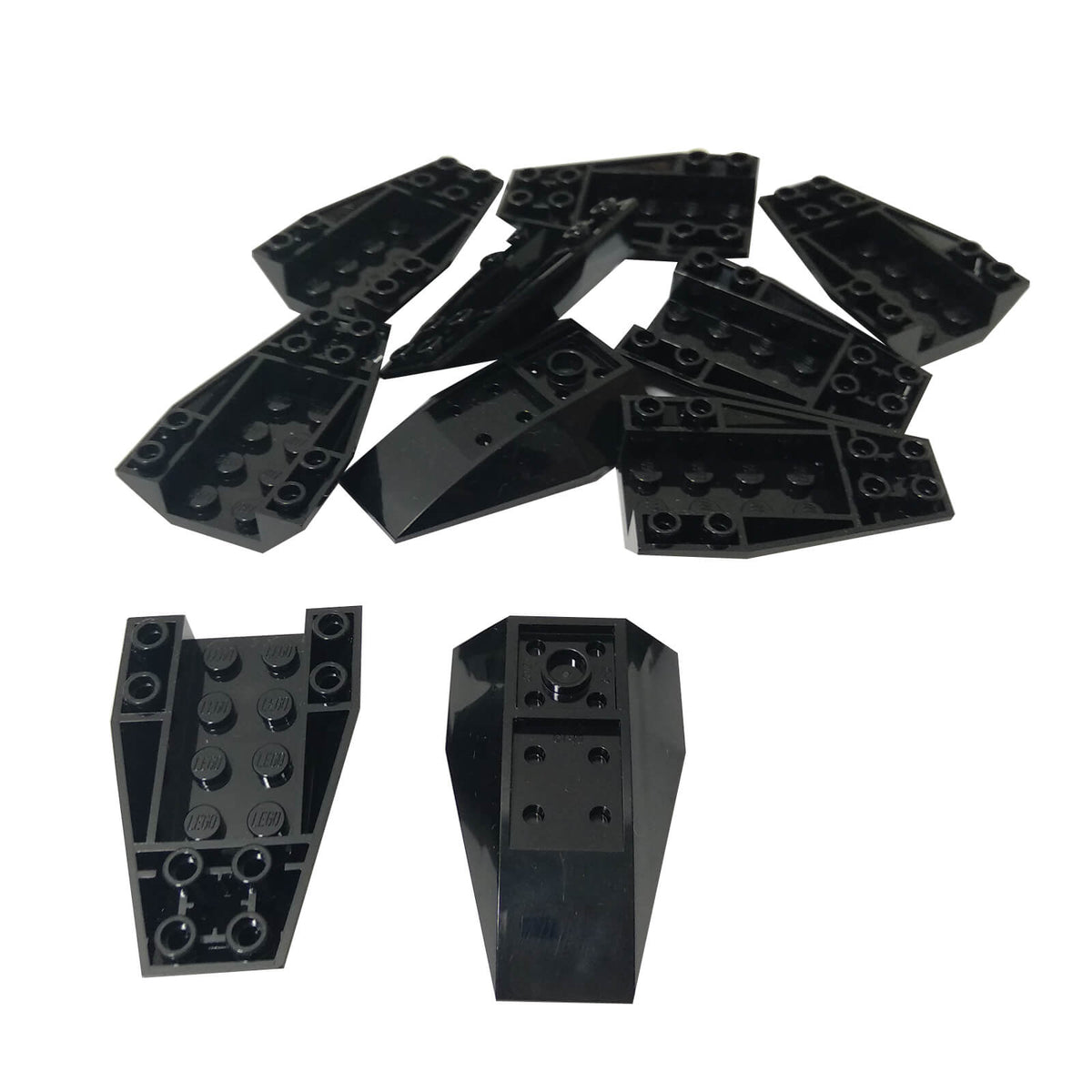 Black LEGO® Part 43713 Wedge 6 x 4 Triple Inverted Curved, showing its curved wedge profile and underside connection details