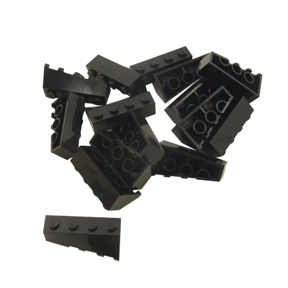 Black LEGO® Part 43721 Wedge 4 x 2 Sloped Left with smooth angled surface and four studs along the upper edge