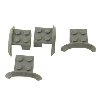 Four dark bluish gray LEGO® Part 98282 vehicle mudguards with curved wheel arches, four top studs and side profiles