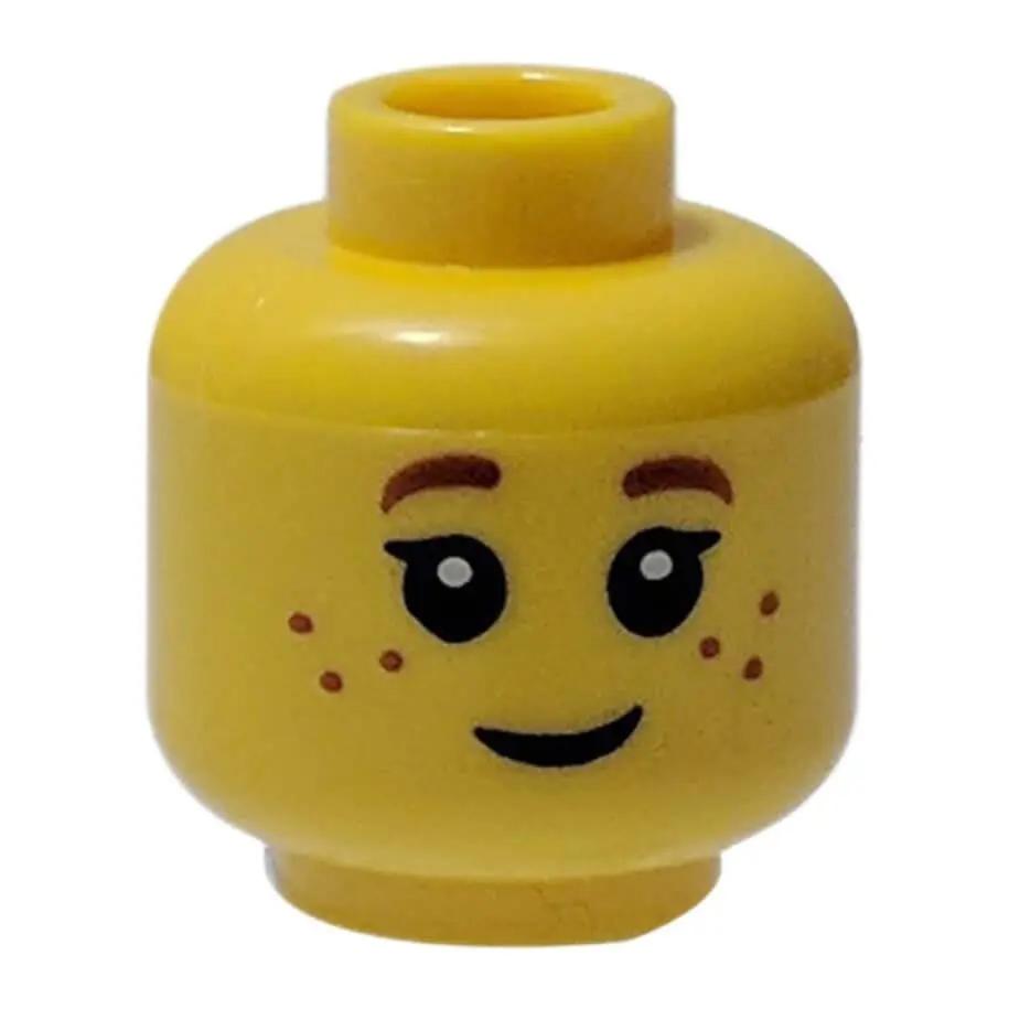 LEGO minifigure head 3626bpb0690 with freckles, eyelashes, and a smile.