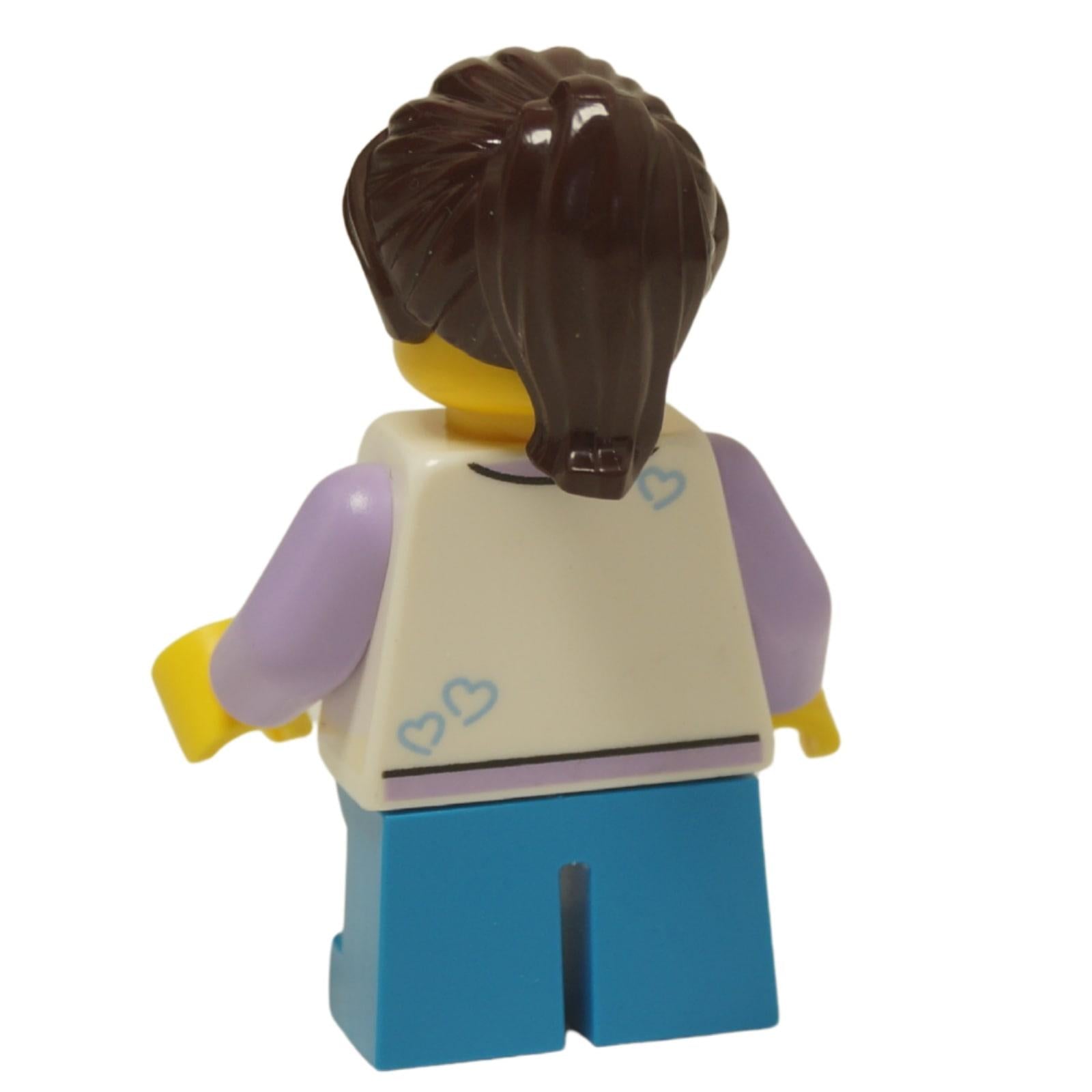 LEGO City child girl minifigure twn498 with raccoon print shirt and dark azure legs. Back view.
