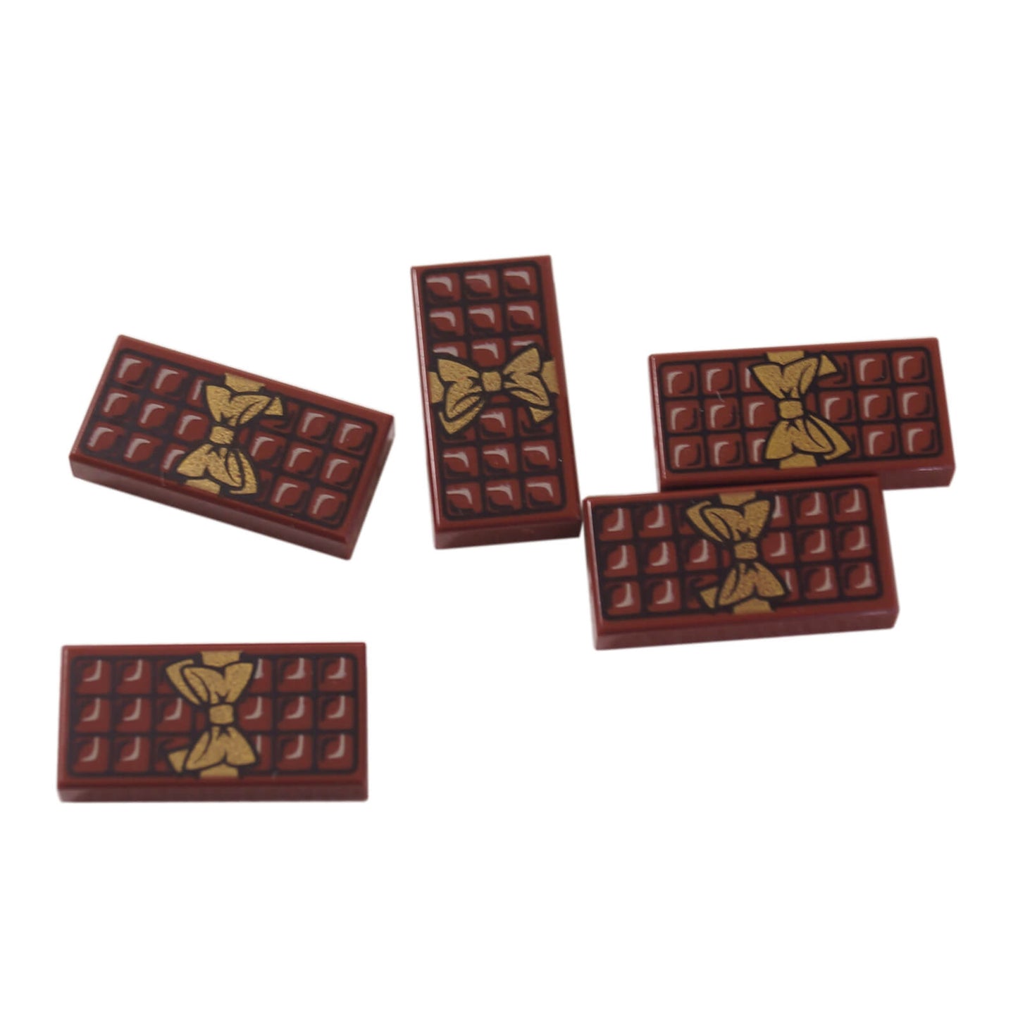 Five LEGO chocolate bar tiles 3069pb440 with gold bows.