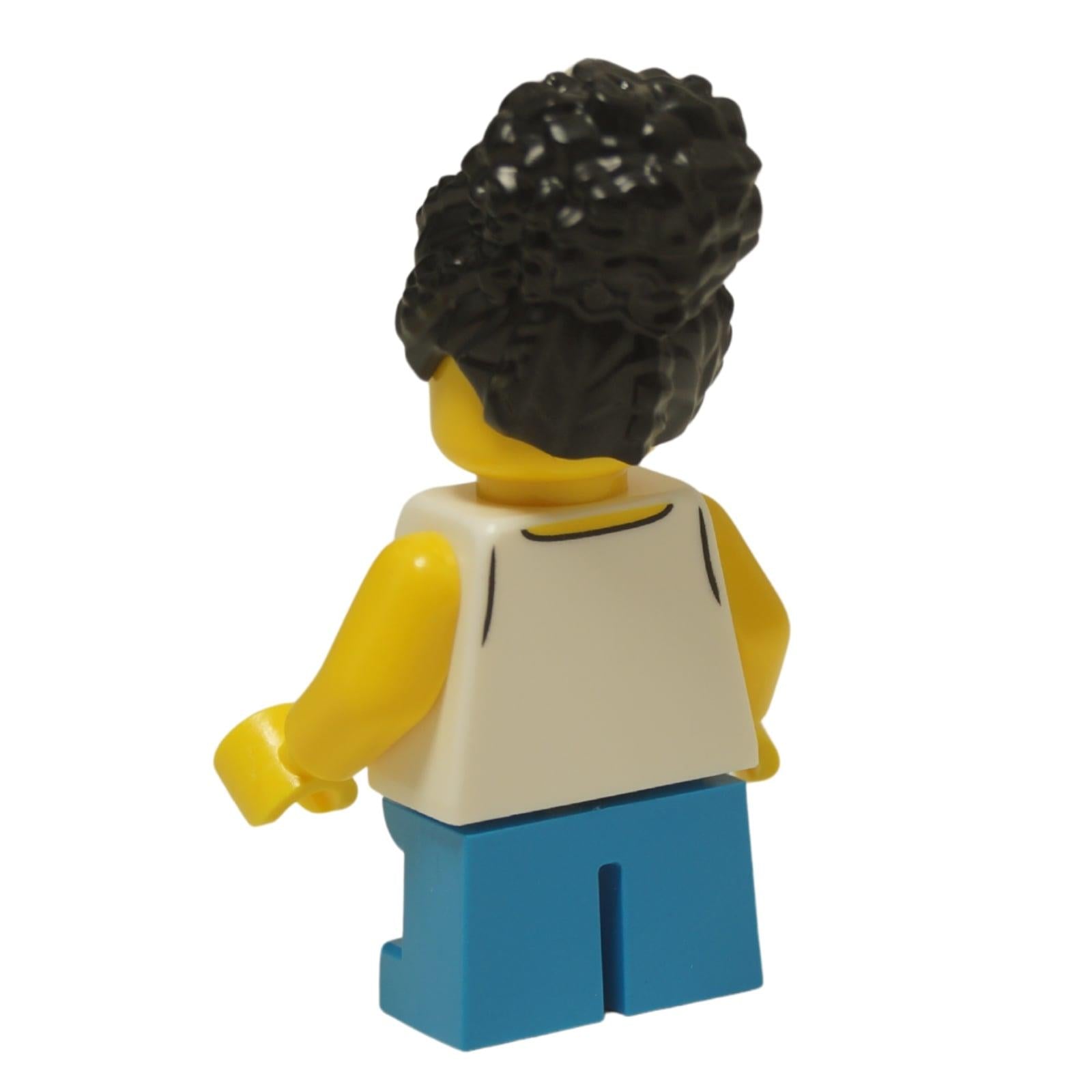 LEGO® City child minifigure (cty1624) with a white sailboat tank top, blue shorts, and a black coiled hair bun. Back view.