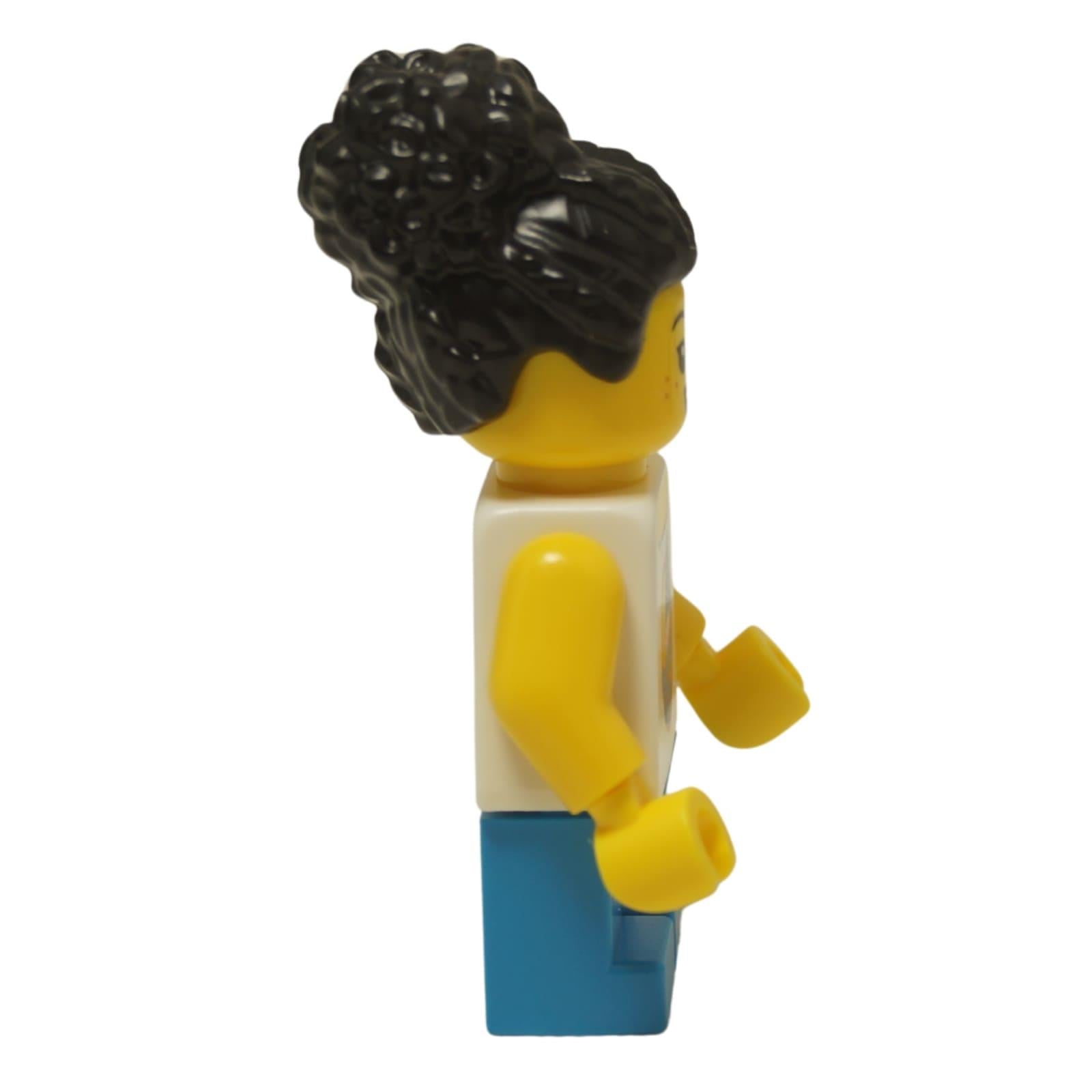 LEGO® City child minifigure (cty1624) with a white sailboat tank top, blue shorts, and a black coiled hair bun. Side view.