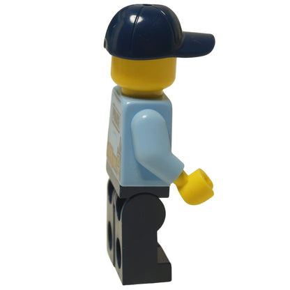 LEGO® City Police Officer minifigure (cty0616) wearing a light blue jacket and dark blue cap, with a determined expression and a scar on his cheek.