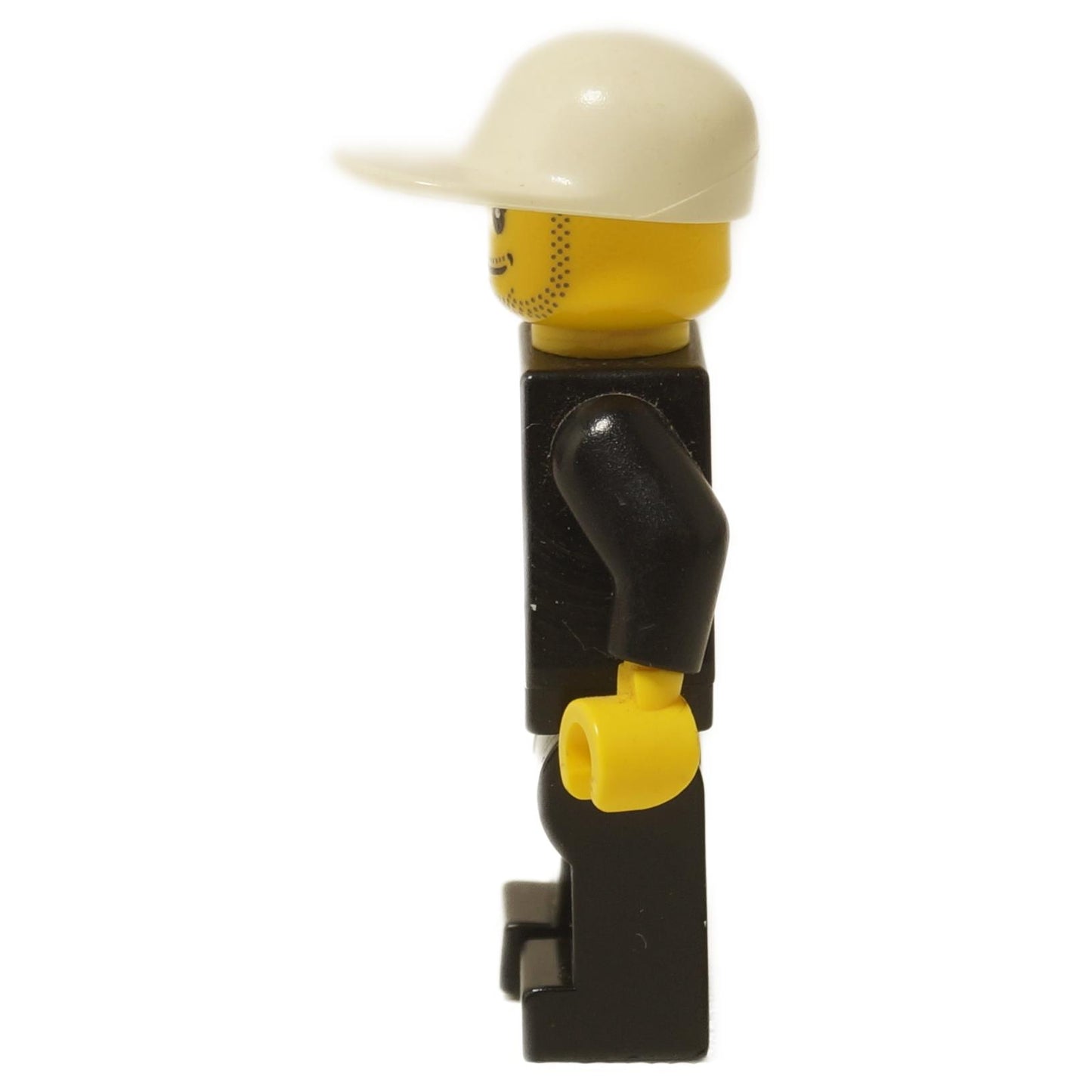 LEGO® City police officer minifigure (cty0204) showing side profile with white cap, stubbled face, and black uniform.