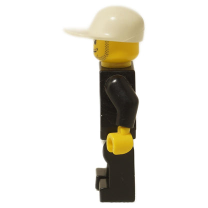 LEGO® City police officer minifigure (cty0204) showing side profile with white cap, stubbled face, and black uniform.