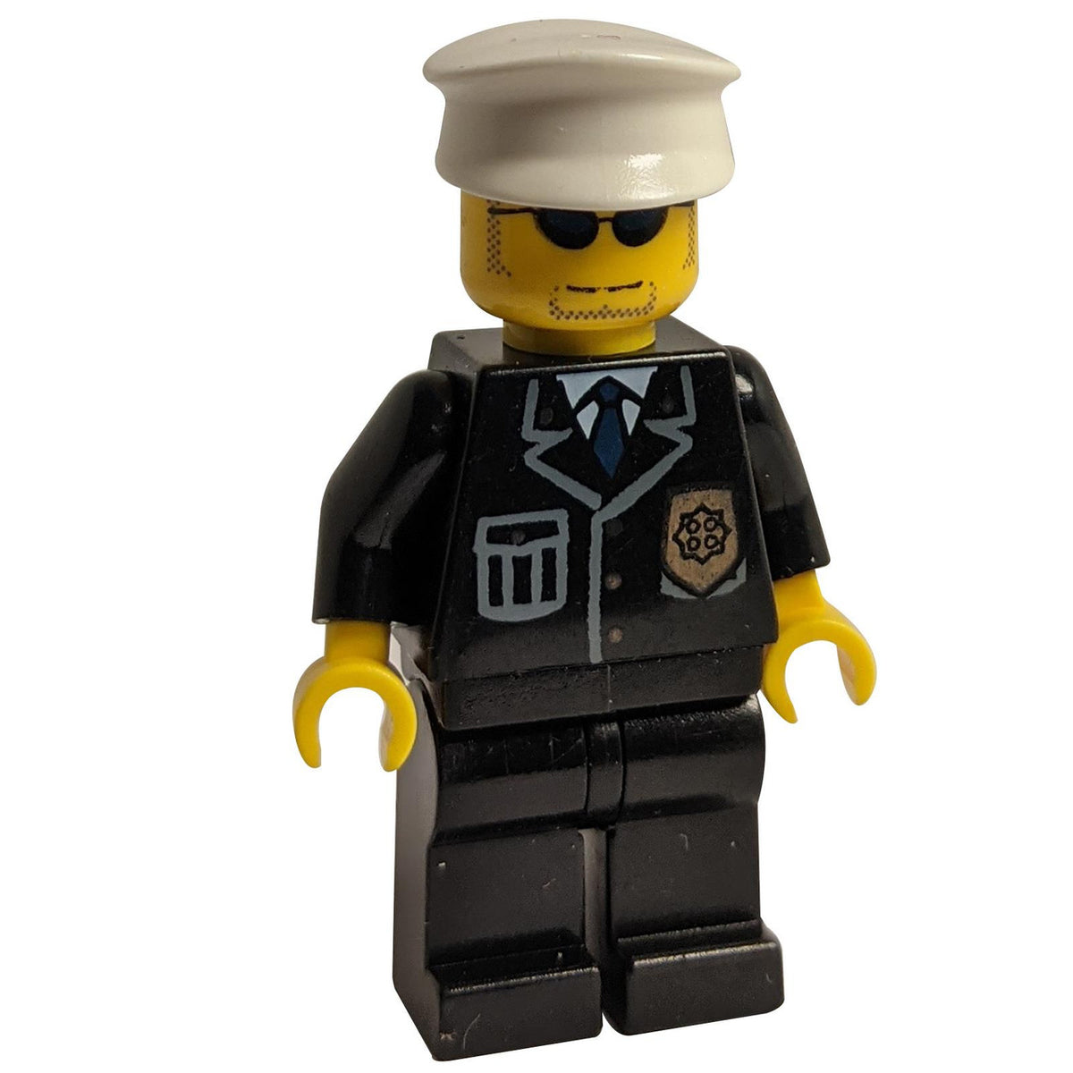 LEGO Police minifigure cty094 with white hat, sunglasses, and blue tie.
