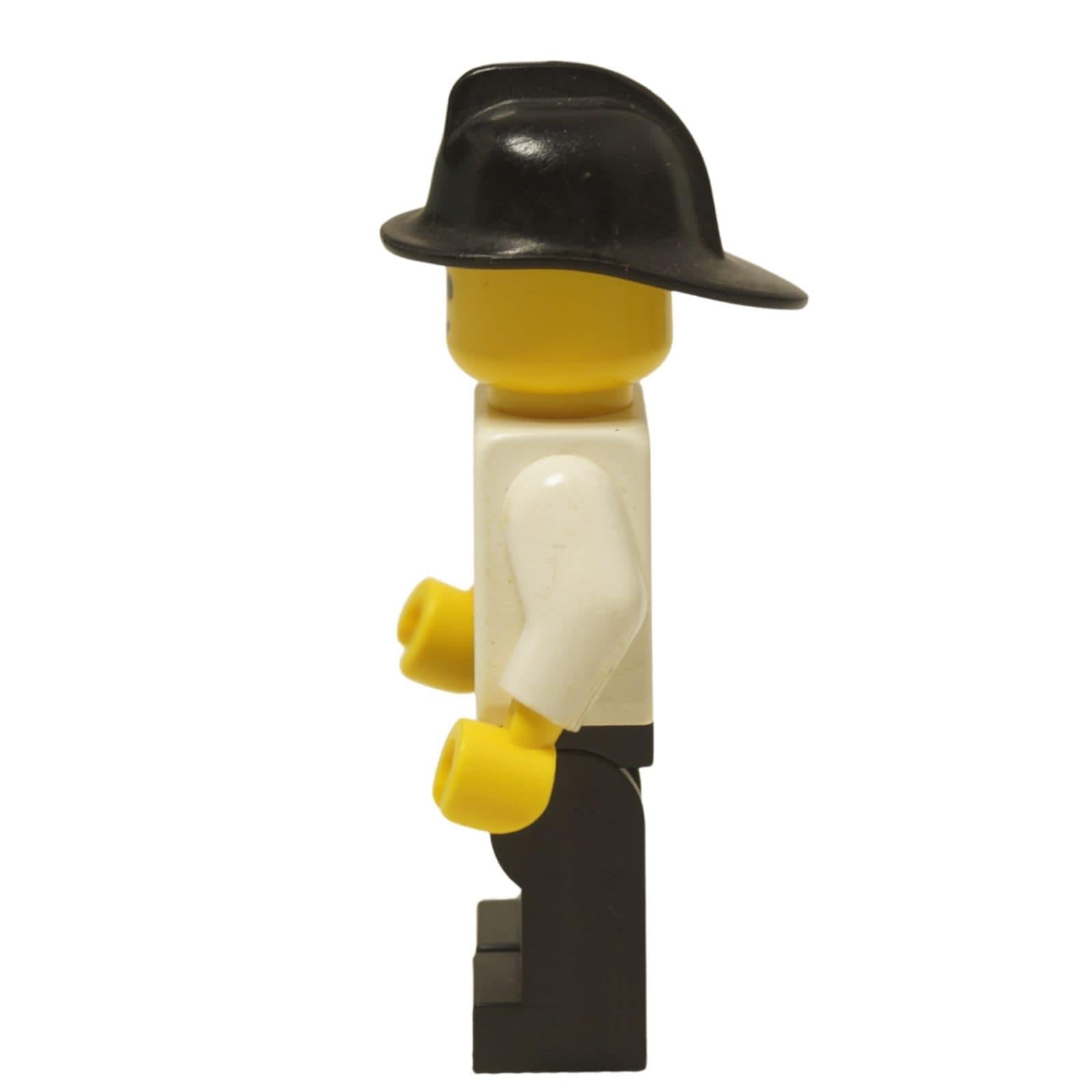 LEGO® Classic Airport worker minifigure (air001) with the iconic striped airplane logo shirt and a black helmet. Side view.