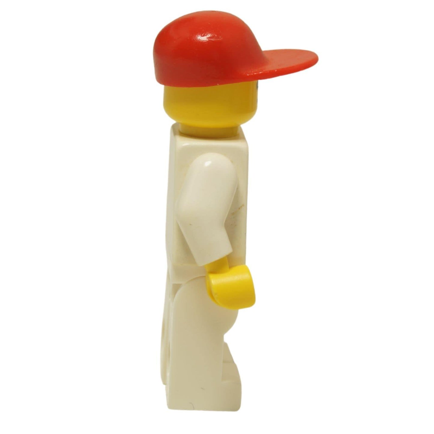 LEGO® Classic Airport worker minifigure (air003) with the iconic striped airplane logo shirt and a red cap. Side view.