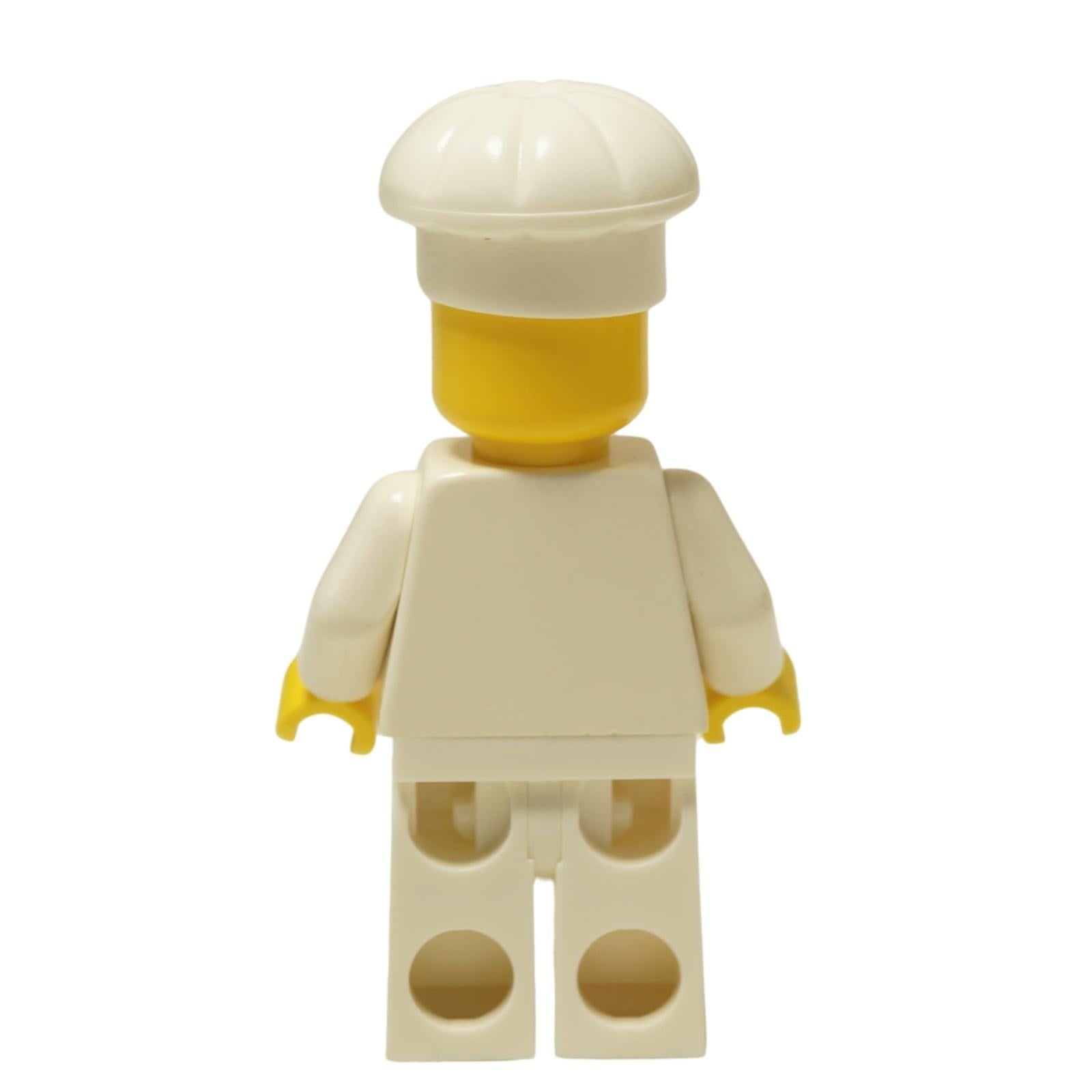 LEGO® Classic Chef minifigure (chef001) with a standard grin, wearing his white uniform and tall chef's hat. Back view.