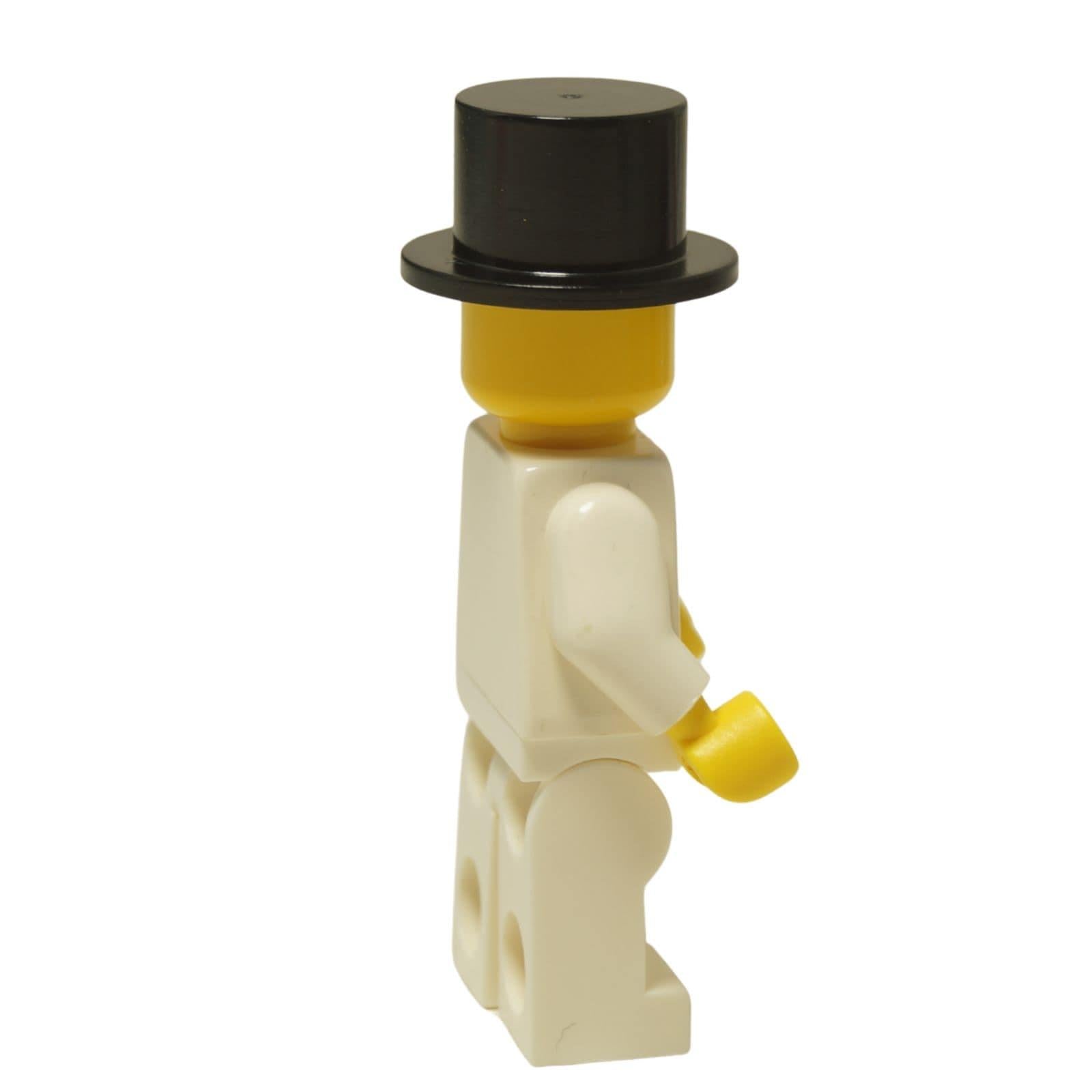 LEGO® Classic Chef minifigure (chef003) with a standard grin, wearing his white uniform and a formal black top hat. Side view.