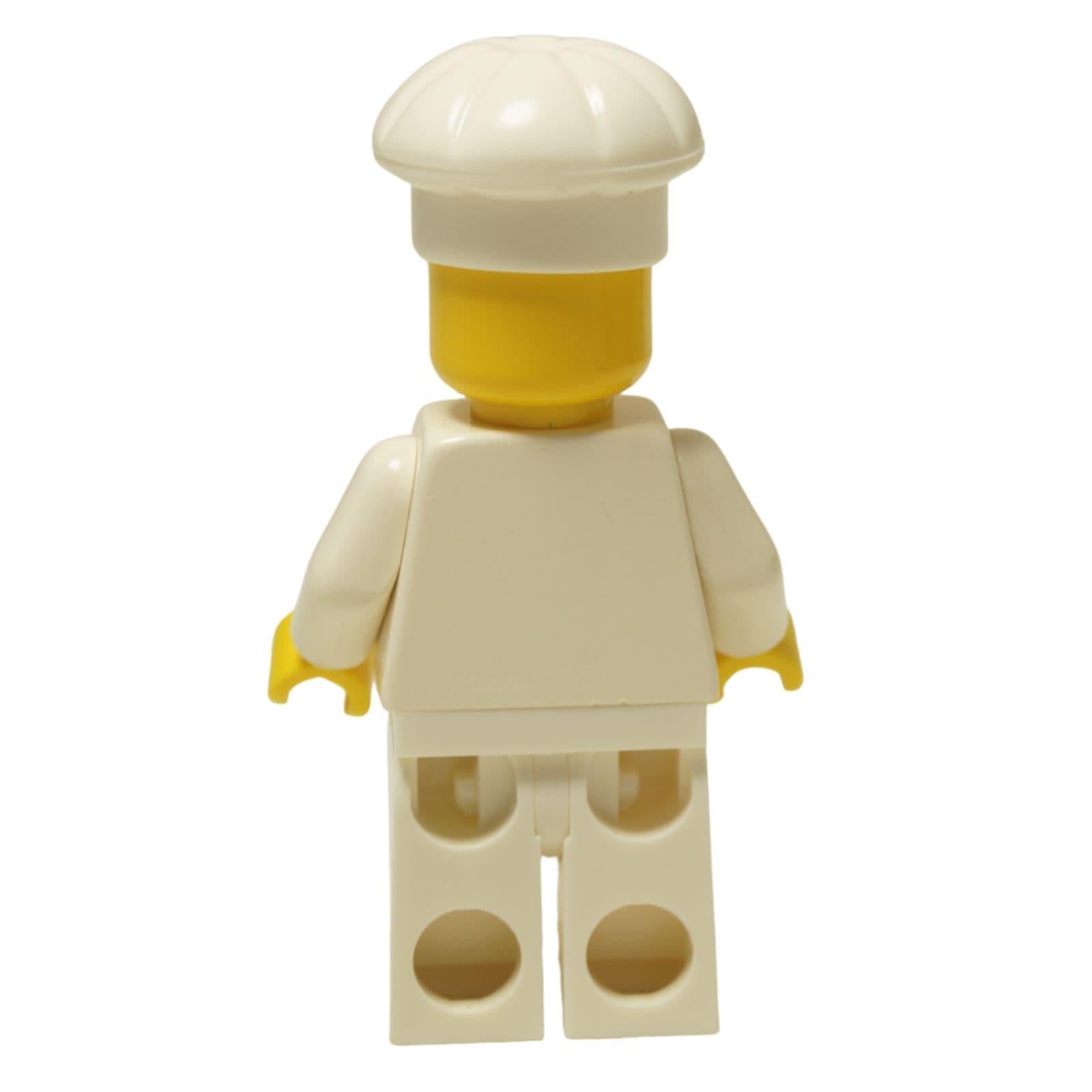 LEGO® Klasická minifigurka Female Chef (chef006) s ženským obličejem, oblečená do bílého uniformy a vysoké kuchařské čepice. Zadní pohled.