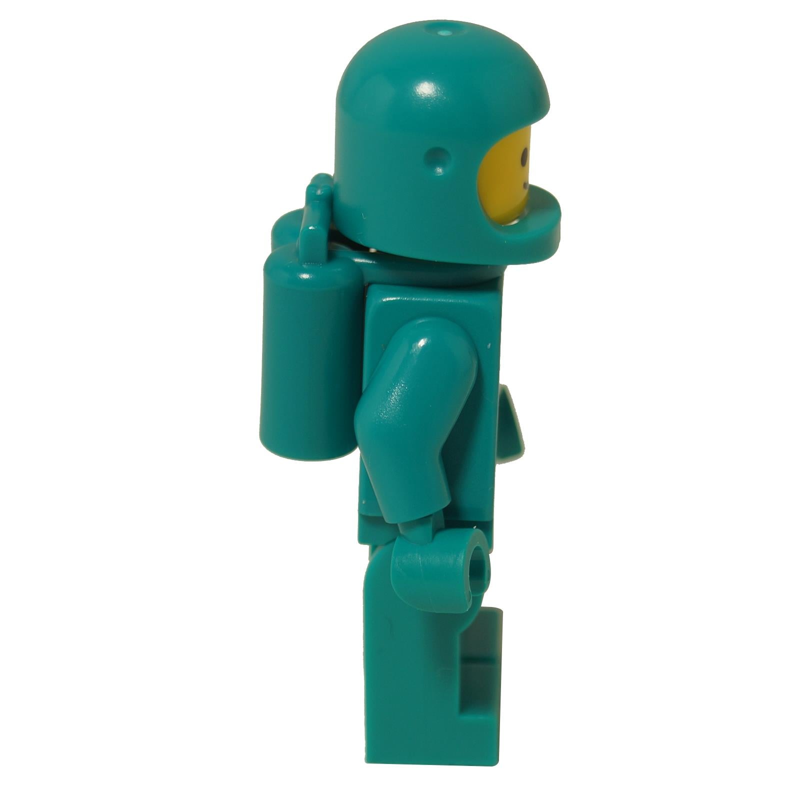 LEGO® Classic Space astronaut minifigure in dark turquoise with vintage space logo, classic helmet and matching suit, side profile view
